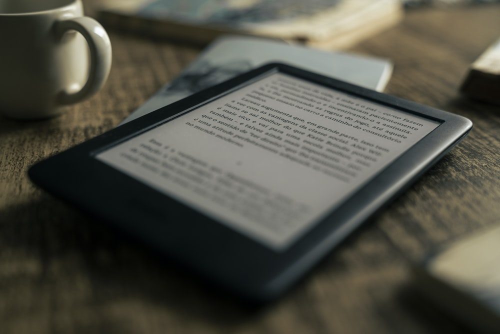 a person reading a book on Kindle