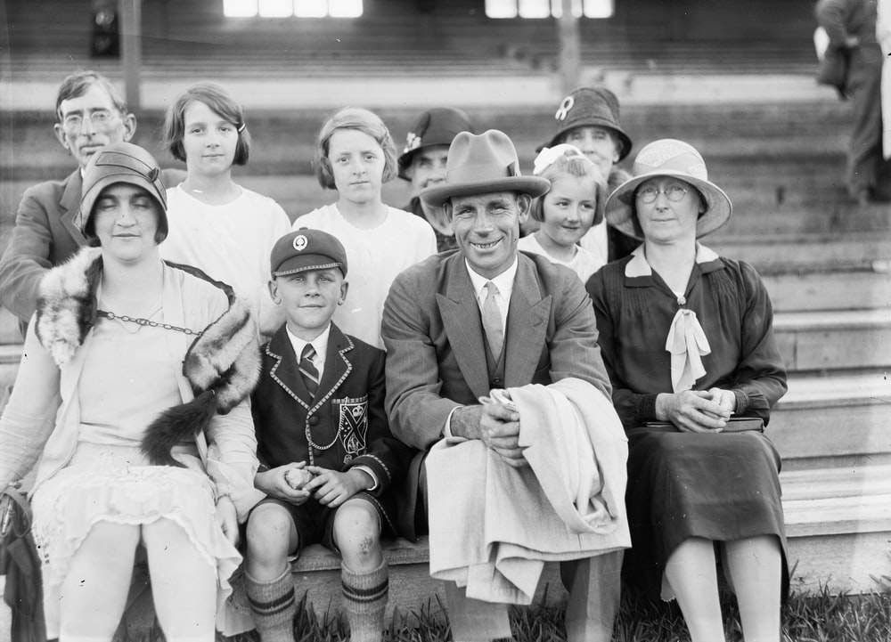 A black and white photograph of a group of people 