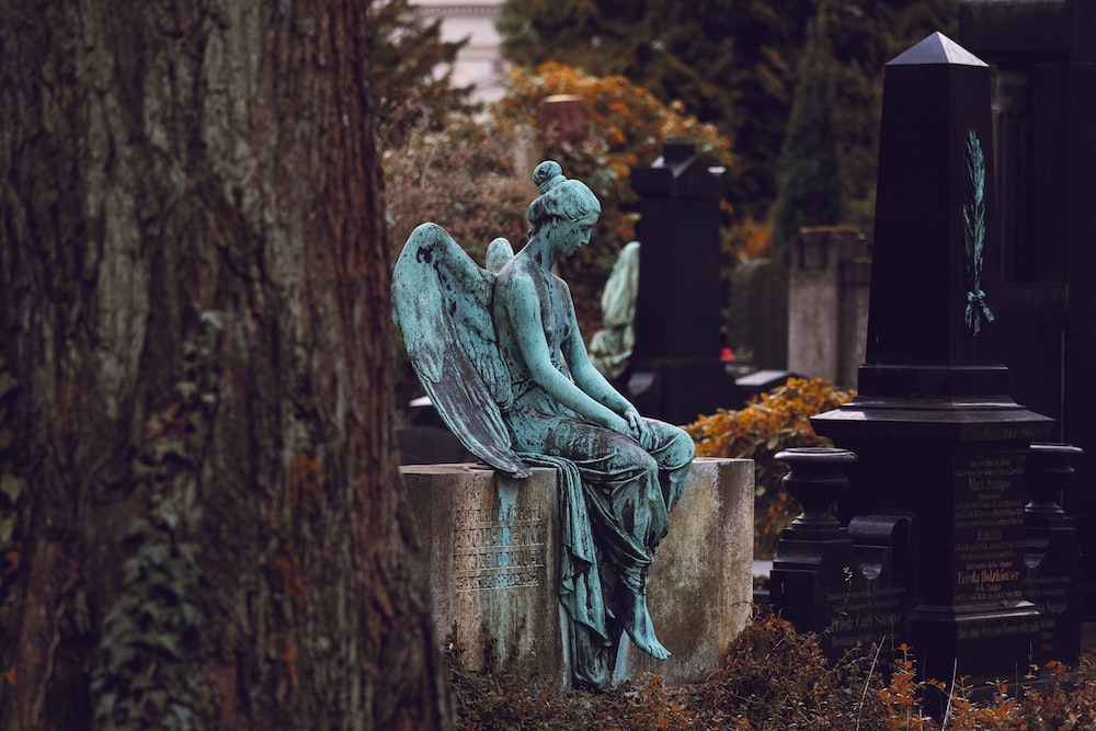 A statue of an angel on a grave