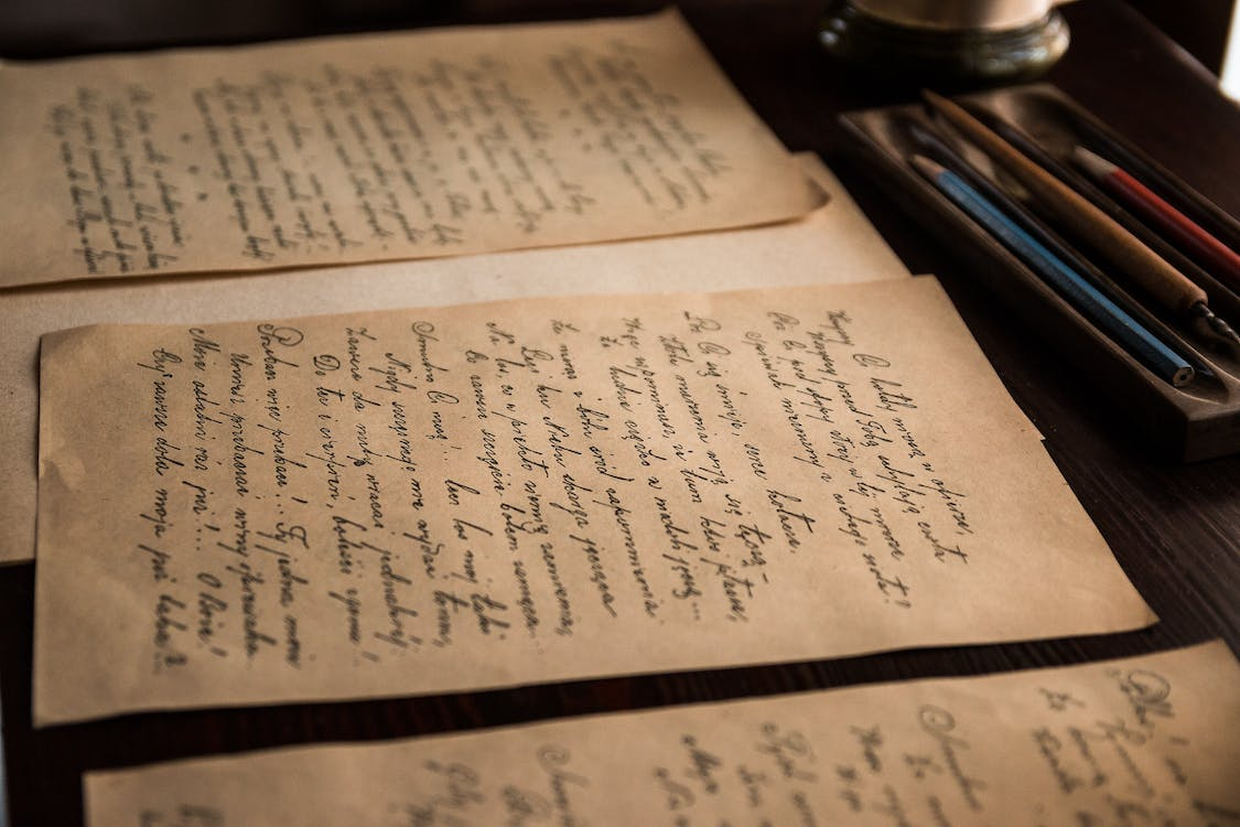 Old papers with text in an italic font 