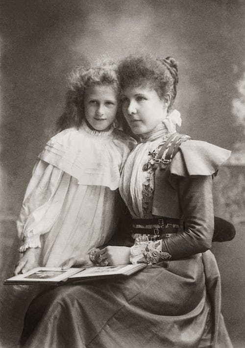 An old photograph of a mother and daughter