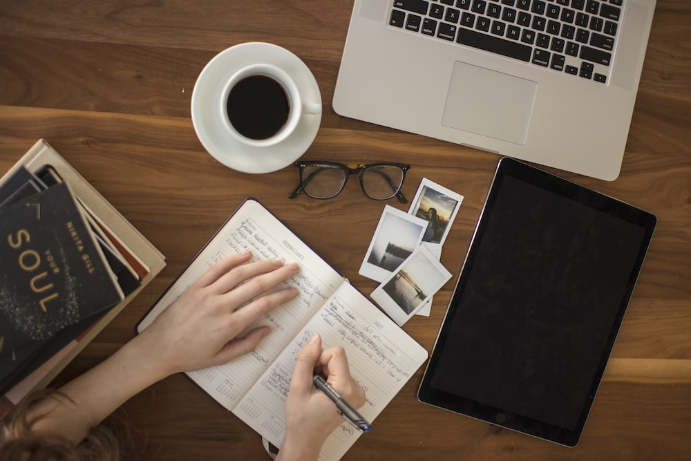 A person writing in a journal