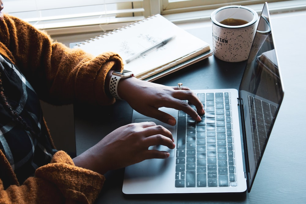 A person researching on a laptop