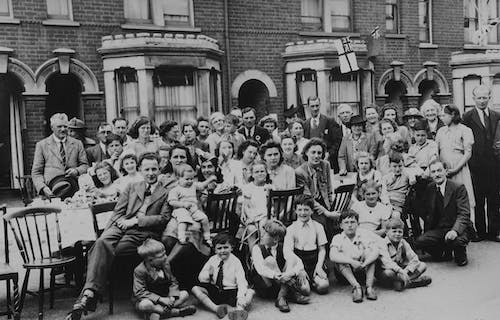 A black and white photograph showing a large family with multiple generations