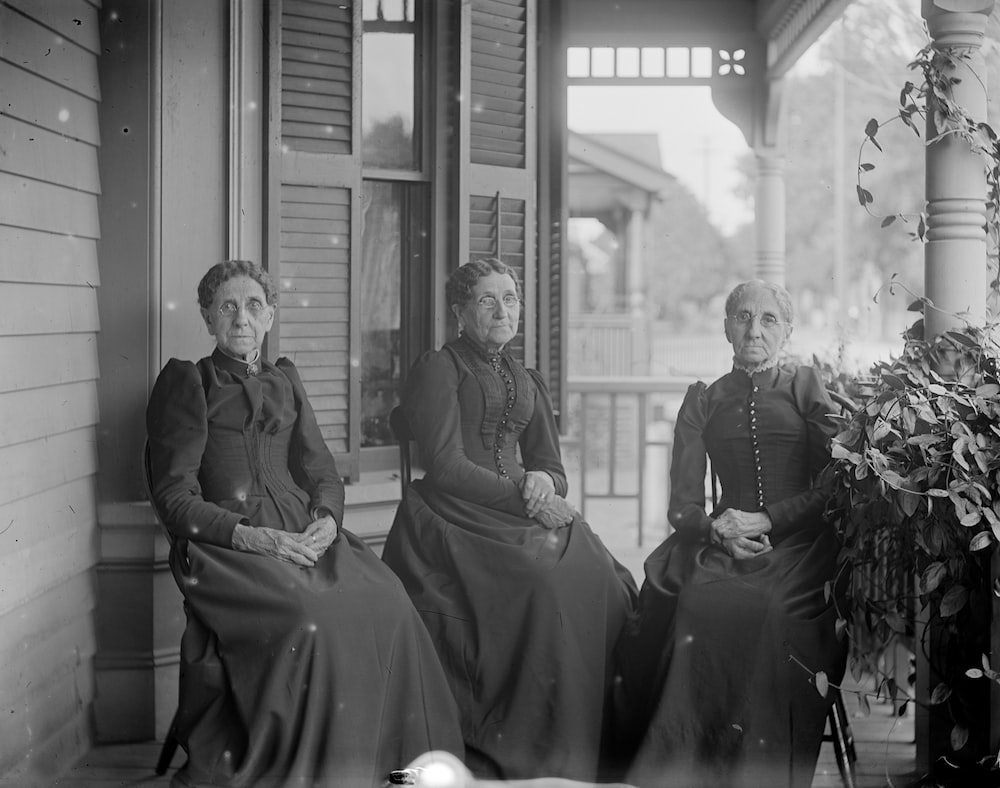 3 similar looking women sitting on a porch illustrating DNA inheritance in genealogy 
