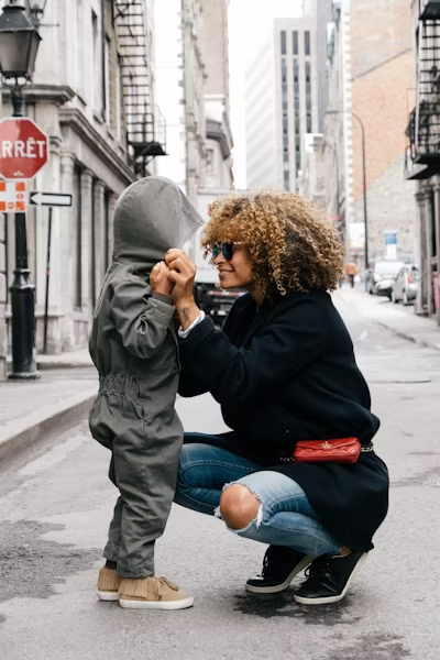a woman with her child outdoors.