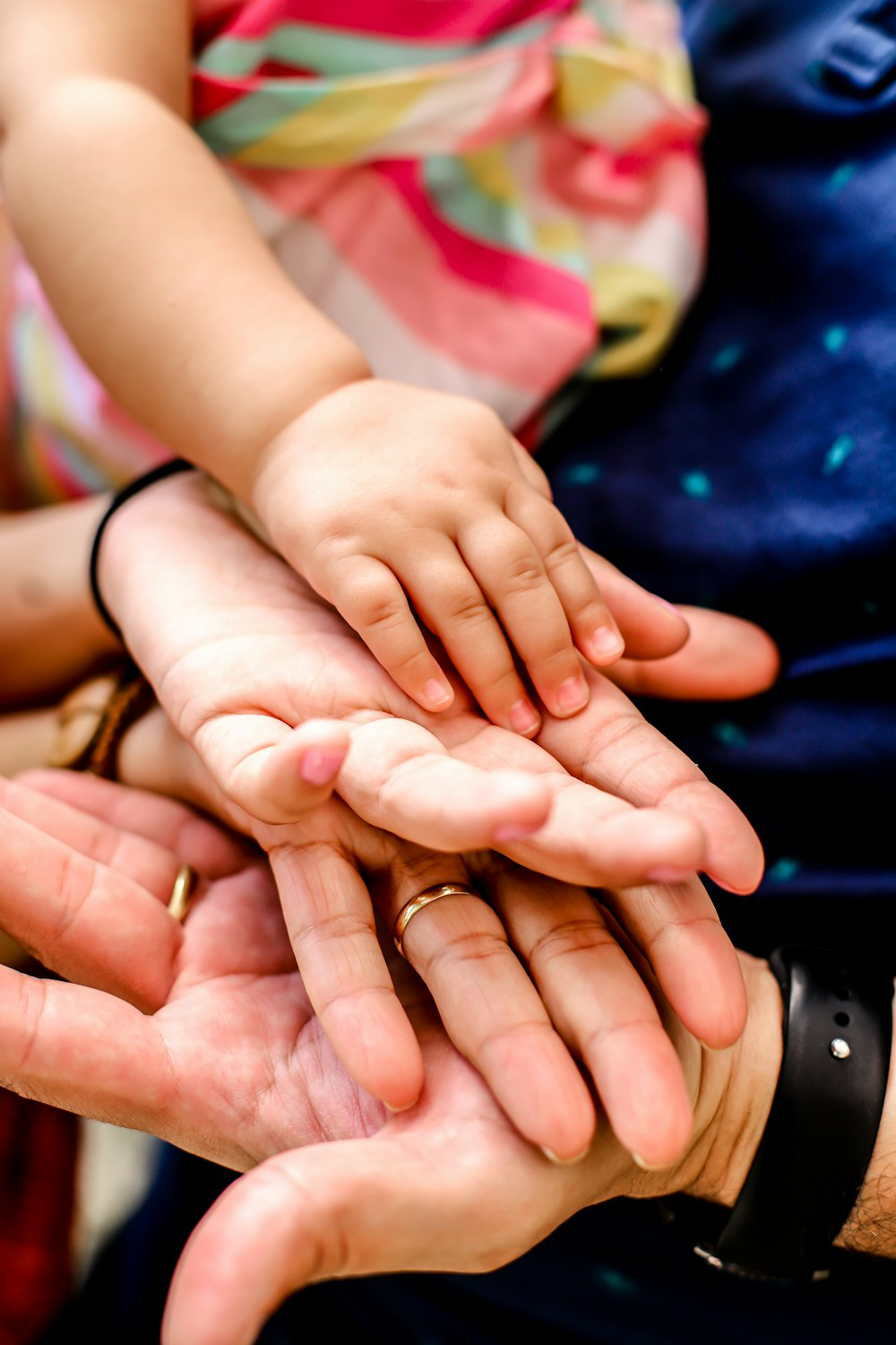 a family holding hands.