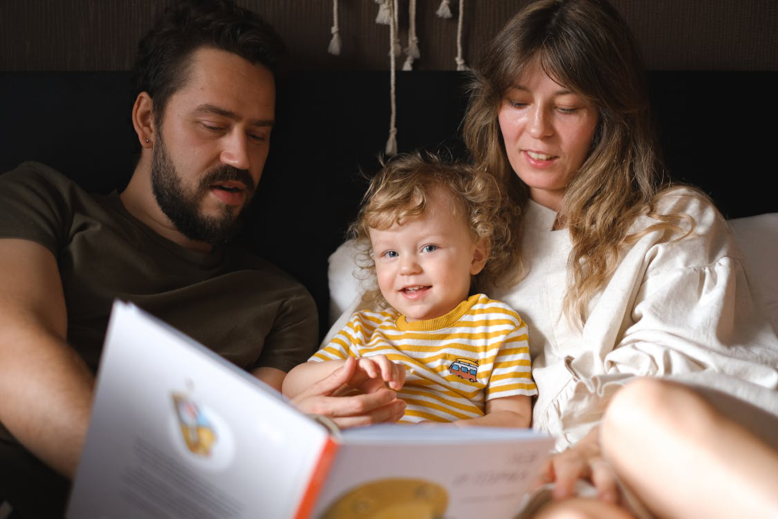 parents sitting with their baby.