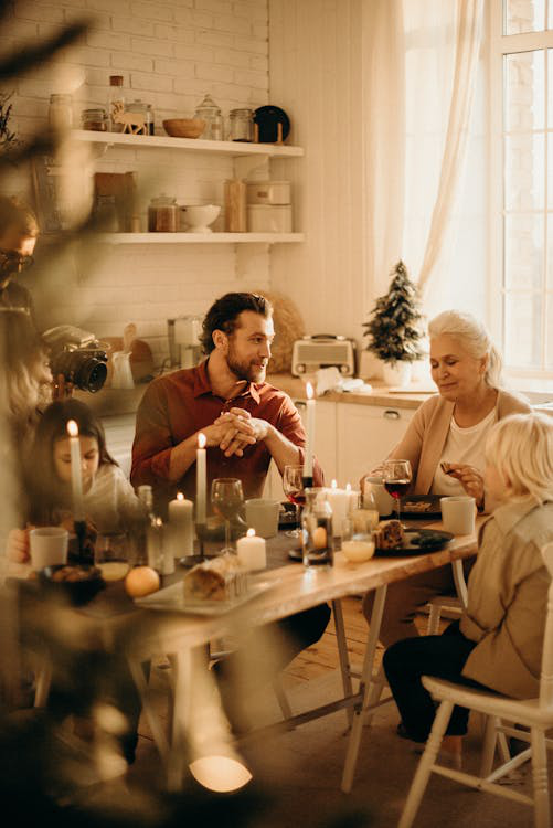 people sitting at the dinner table.