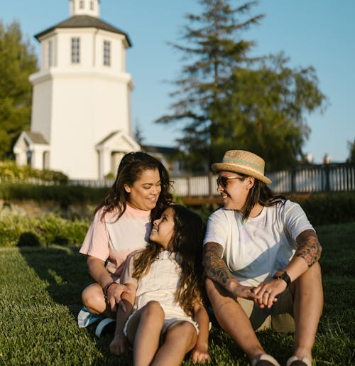 man-woman-couple-sitting-outdoors