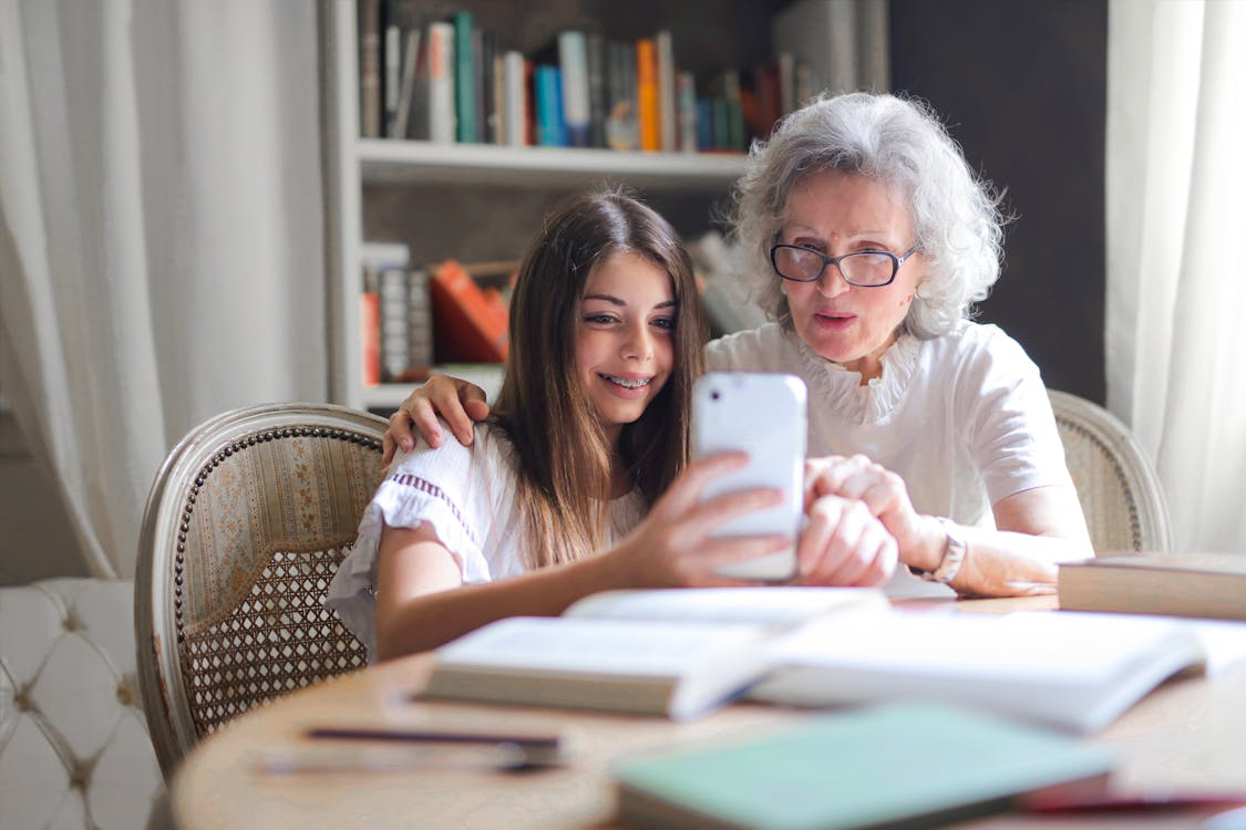 two people looking at a phone.