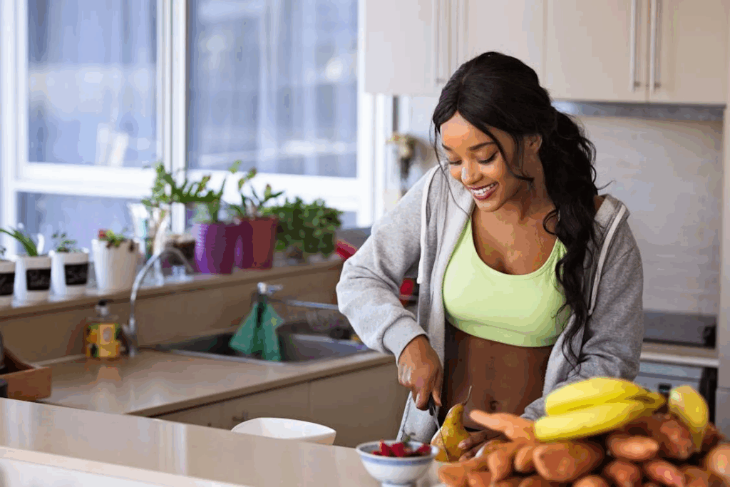 a woman cutting up fruits.