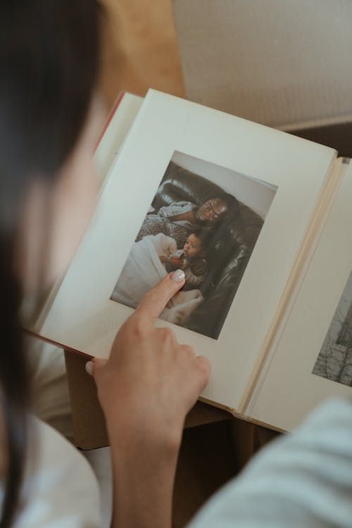 a woman looking at old photographs.