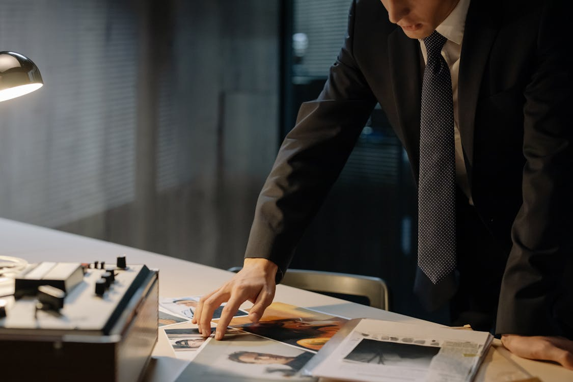 A man looking at photographs.