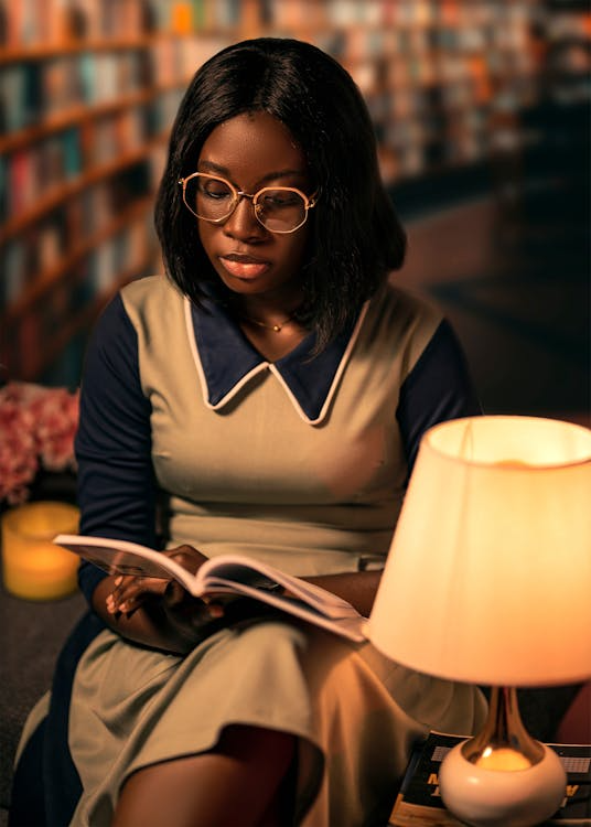 a woman studying at the library.