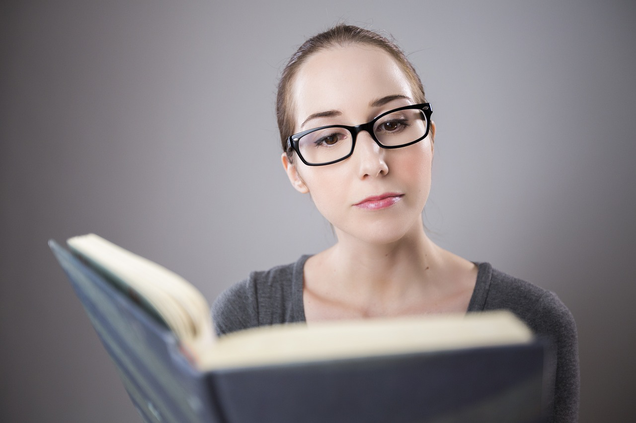a woman holding a book.