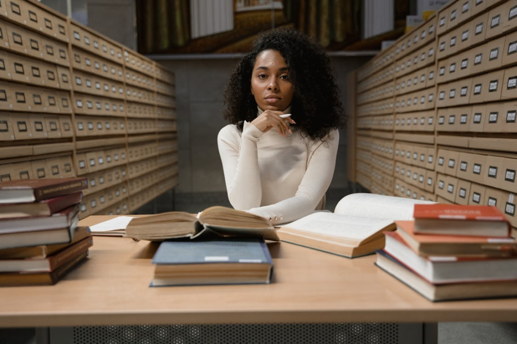 a woman in a white shirt in a library.