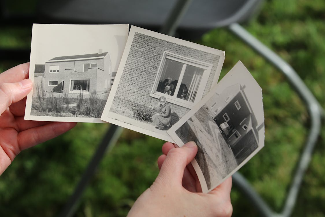 a person holding some photographs.