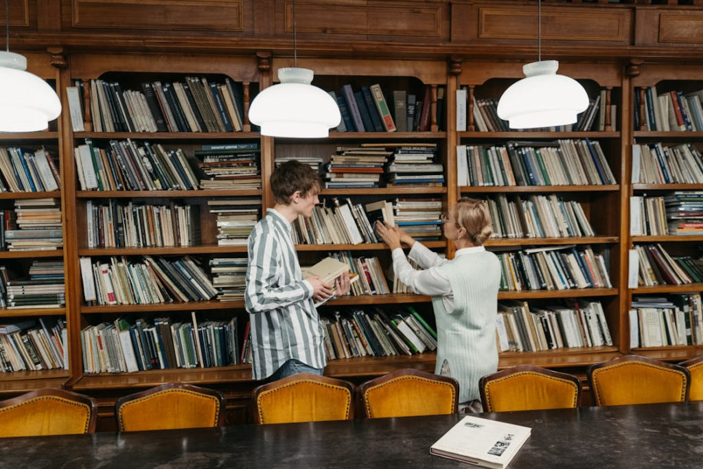 two people standing in the library.