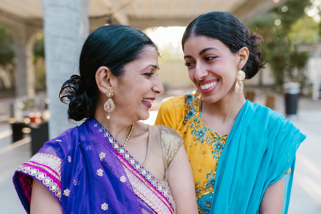 a woman and her daughter in traditional clothes