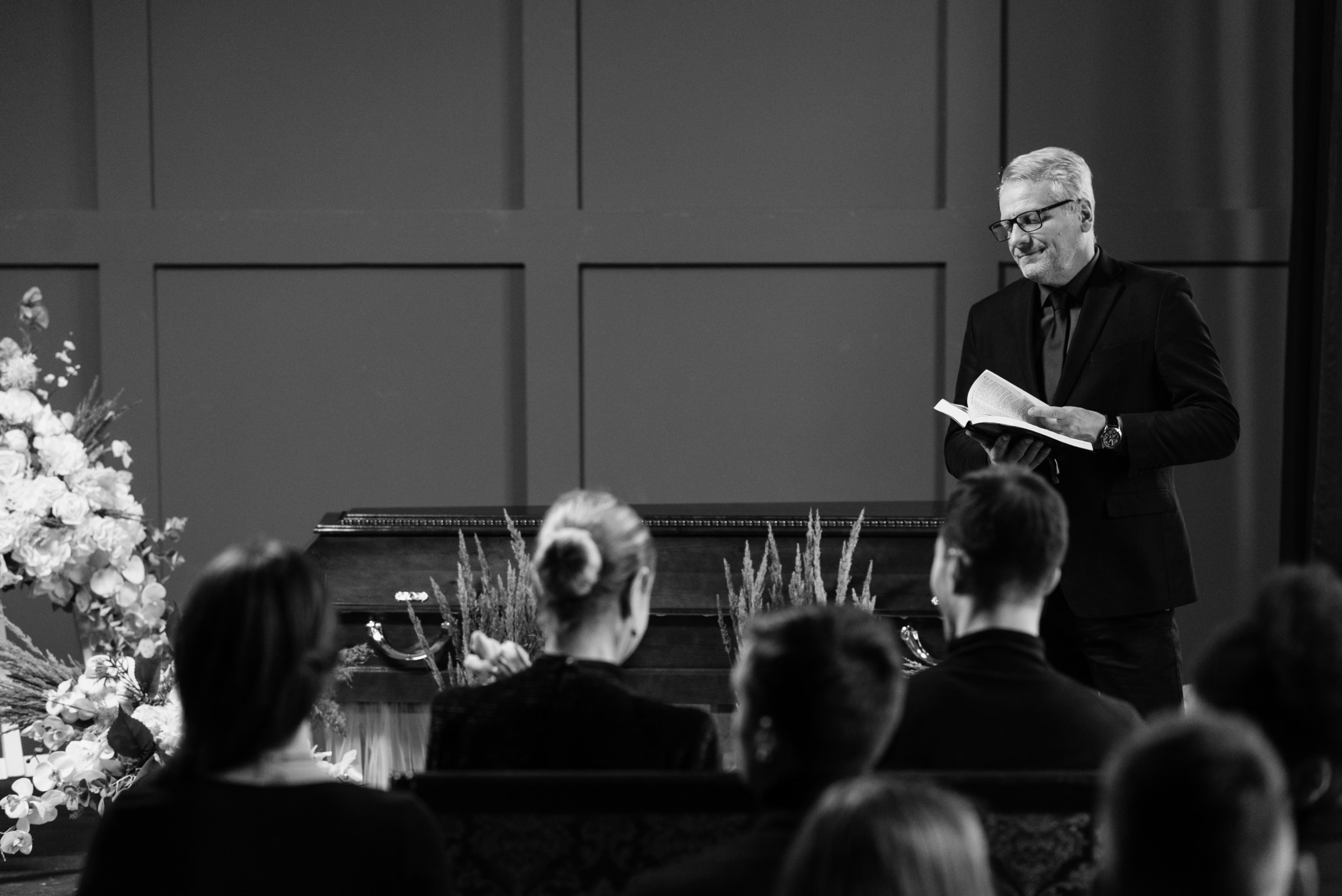 people sitting at a funeral.