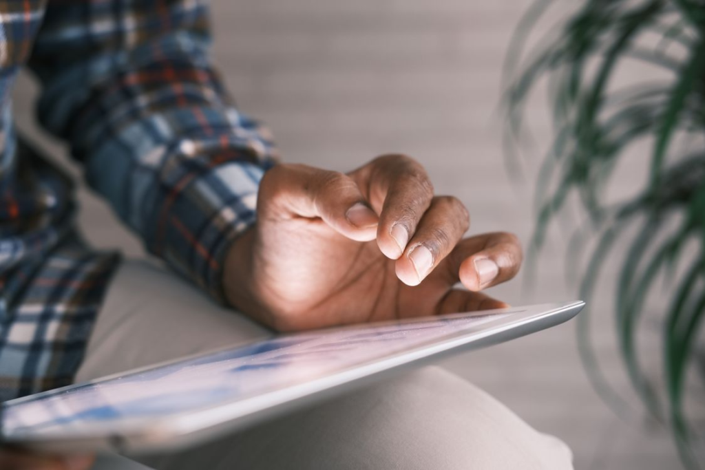 a person holding a tablet.